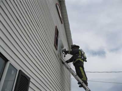 (3) While the entry firefighter is searching the room, the oriented firefighter stays on the ladder with the TIC at the window monitoring conditions while staying in voice contact with the entry firefighter and acting as his safety lookout.