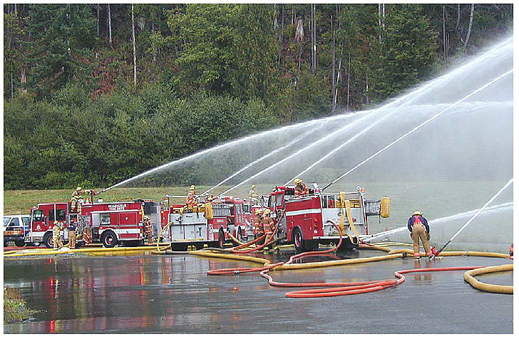 Fire trucks flowing water