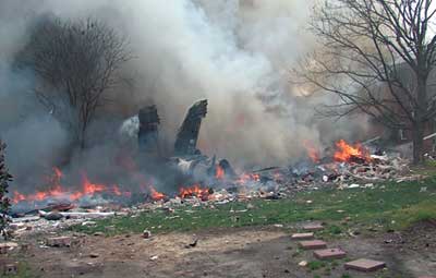 (1) The FA-18D lies in the courtyard of an apartment complex moments after impact. (Photo by Martin Grube.)