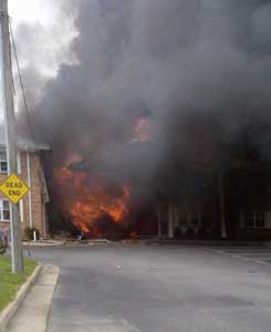 (5) Entrance of Mayfair Mews Apartment Complex (side A) moments after impact. [Photo by Robert Oechsner, Virginia Beach (VA) Fire Department.]