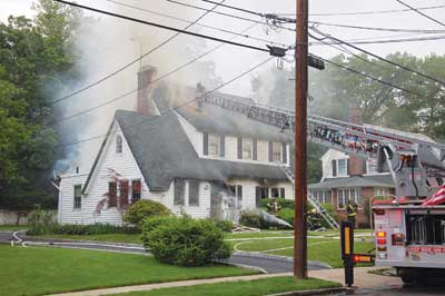 (1) The building on the exposure 4 or D side appears to have a rear porch. This building has an enclosed rear porch; who did the work? (Photos by Bill Tompkins.)