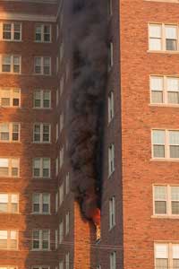 (1) Detroit firefighters arrive to find fire on the fourth floor autoexposing the apartment above.