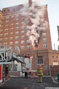 (6) Conversion of the fire is seen quickly after arrival of the first-due companies, and the other areas on the fire floor and floor above near the main stairwell only experienced moderate smoke conditions.