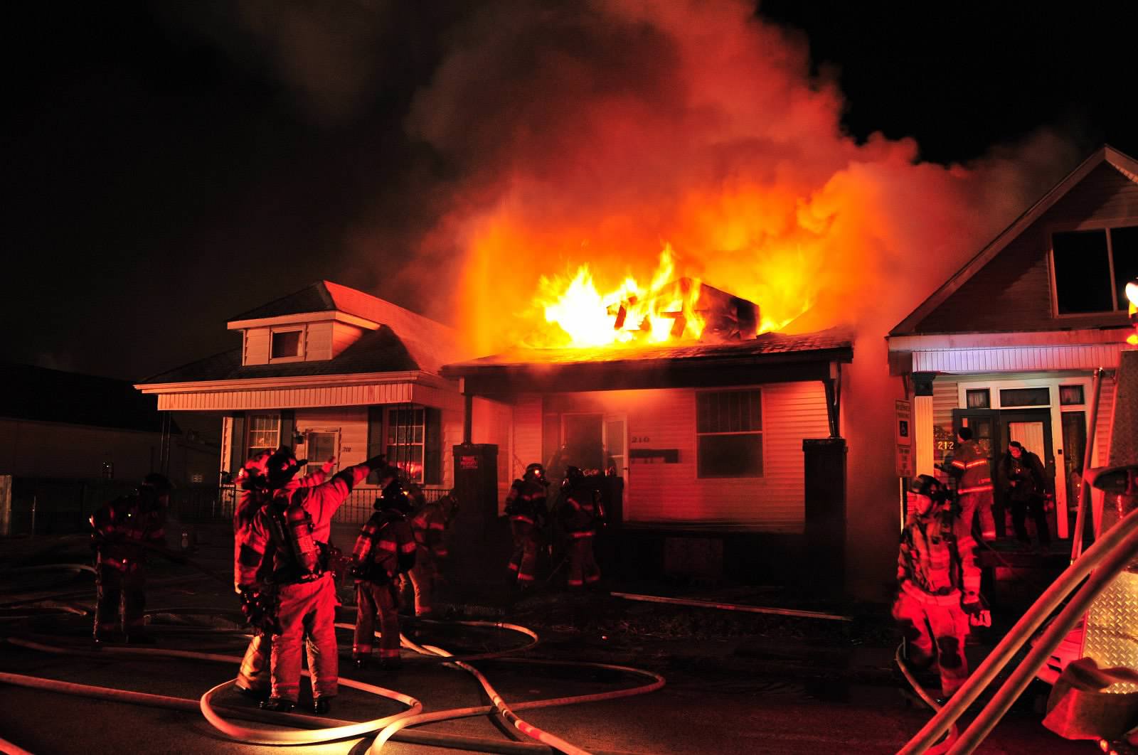 IN Firefighters Contain House Fire. Photo by John Buckman