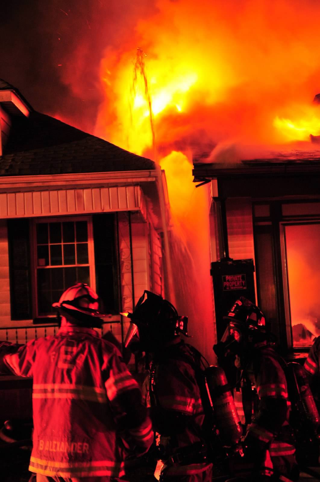 IN Firefighters Contain House Fire. Photo by John Buckman