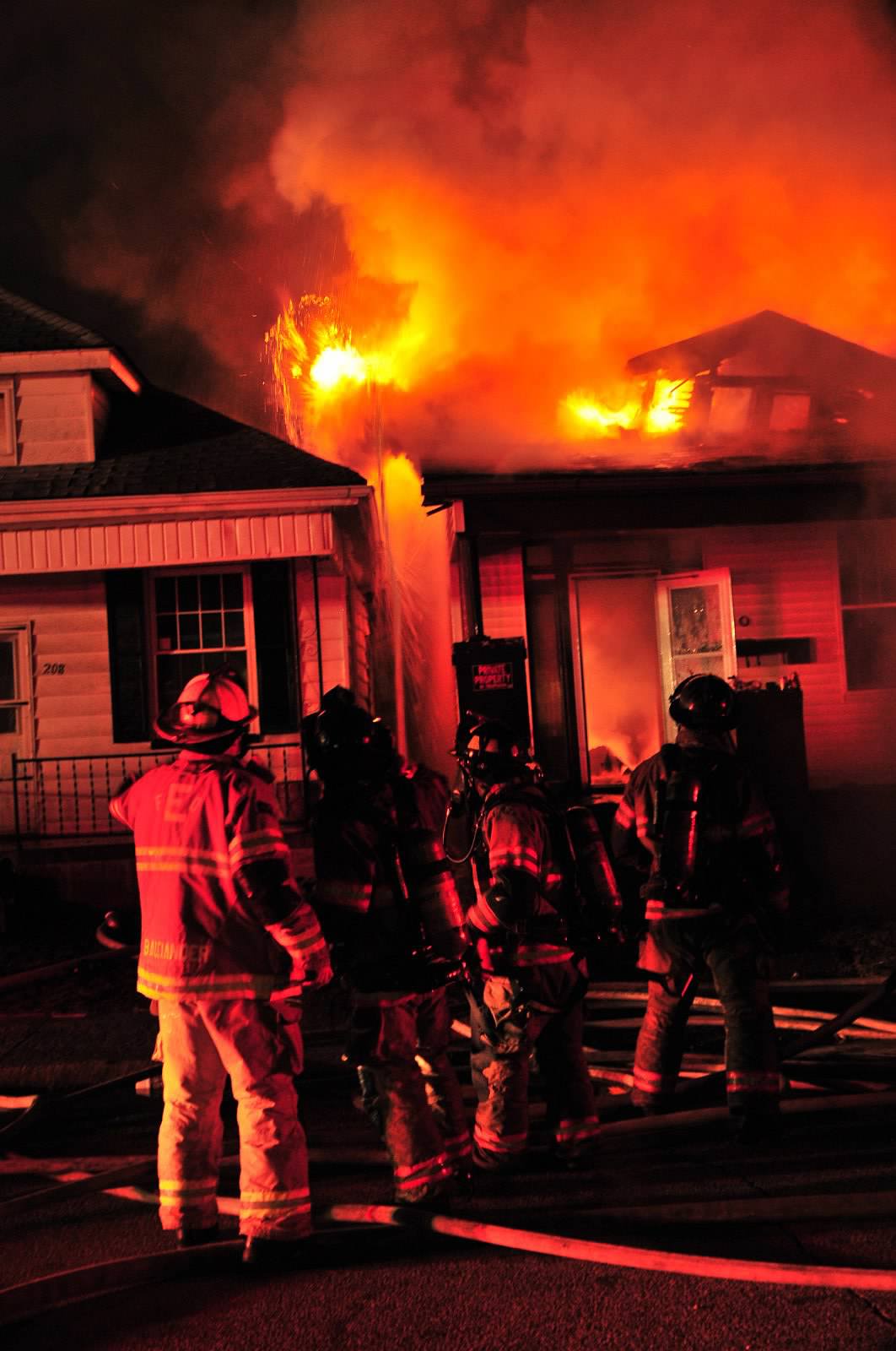 IN Firefighters Contain House Fire. Photo by John Buckman