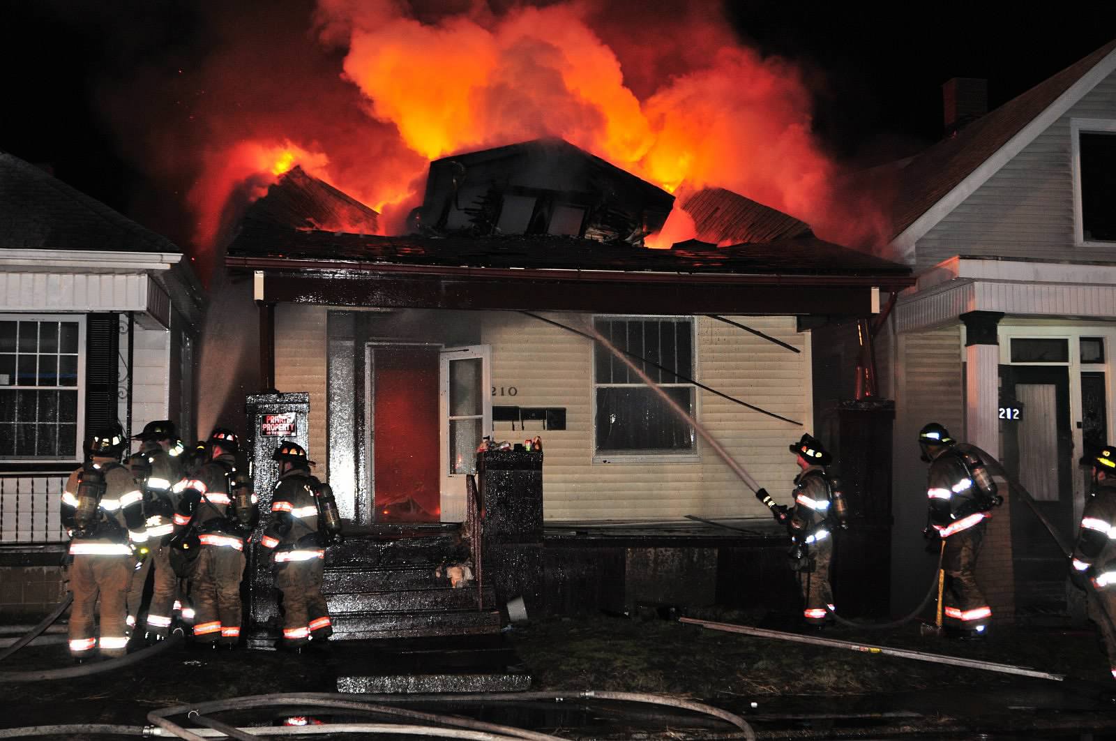 IN Firefighters Contain House Fire. Photo by John Buckman