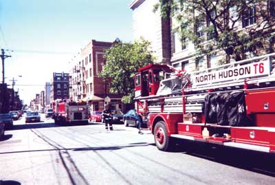 (2) Using a guide to back a rig into position assists in safety and control. Here it is done in the soft investigative mode. Remember, just because there is a fire does not mean that you abandon this position. Every time you correctly conduct this operation, the more likely you will do it when there is something showing. (Photo by author.)