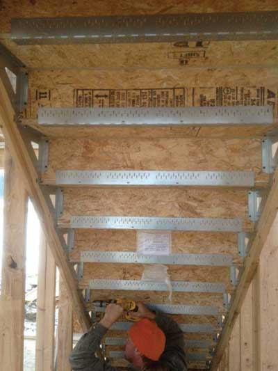 (2) The I-stair is just the latest challenge we face in today's disposable structure. This unprotected stairway may pose a significant risk for occupants trying to evacuate a burning residence. (Photo by Dennis Van Tassell.)