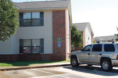 (7) The blue diamond is located on the front corner of a lightweight wood-frame apartment building to alert firefighters. (Photo by author.)