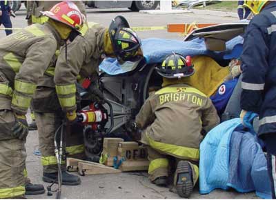 (3) Firefighters during an extrication challenge. (4) Depleted SRS air bags 