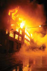 (2) This fire, which occurred on January 22, 2013, went to five alarms and two specials in subzero temperatures. The fire consumed an approximately 200- × 200-foot vacant warehouse and extended to an adjacent commercial building.