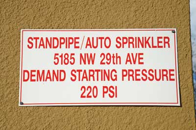 (24) A sign posted near the FDC indicates a pressure to pump combination standpipe/sprinkler system equipped with PRVs. If the building's fire pump fails, the fire department will have to pump 220 psi, even if firefighters were to use standpipe outlets on the first floor.