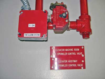 (25) Valves controlling the sprinklers in an elevator hoistway and machine room.