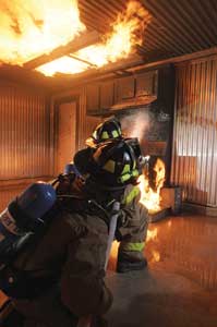 (1) Live fire training exercise in a Class B (propane fueled) burn building. (Photo courtesy of Draeger Safety, Inc.)