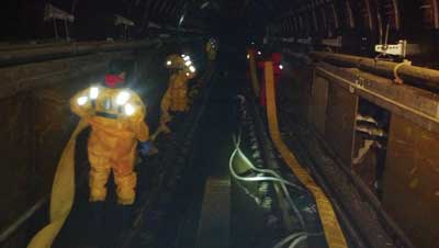 PATH dewatering operations: (1) The use of a wye enabled members to use two five-inch hoses instead of one six-inch hose to remove water. Here, they are laying hose adjacent to the tracks on both sides of the tube. (Photos by author.)