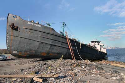 (1) This barge broke away from its mooring in Staten Island, New York, during Hurricane Sandy and ended up grounded. (Photos by Steve Spak.)