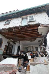 (5) This home in Seagate, Coney Island, New York, was totaled. 