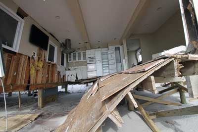 (8) Damaged home on Fire Island.