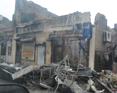 (3) This commercial building on Rockaway Beach Boulevard at Beach 114th Street was damaged by fire. Firefighters from Engine 268 and Ladder 137 drove up to this fire while relocating from quarters on Beach 116th Street. After they started operations, surge water from the ocean, only 800 feet to the south, rose to six feet and stalled the apparatus and severely threatened the firefighters. Civilians trapped by the rapidly expanding fire were rescued by the members and firefighters from Swift Water 2. Hours later, as the water receded below Engine 268's exhaust, the apparatus started, and suppression efforts stopped the fire after it had destroyed 21 buildings.