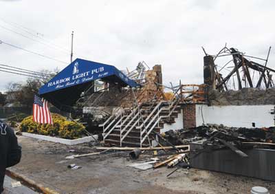 (6) A view of the Harbor Light Restaurant (with awning) from Newport Avenue and 