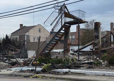  (7) of its fire escape from Beach 130th Street. The Harbor Light served as a foundation for the residents of Belle Harbor and adjoining neighborhoods. It was near the middle of the rapidly extending fire. FDNY units stopped the fire midblock between Newport and Cronston Avenues.