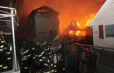 (1) Dozens of houses were already on fire in Breezy Point before FDNY arrived on the scene. (Photos 1-2 by Todd Maisel, NY Daily News via Getty Images.)