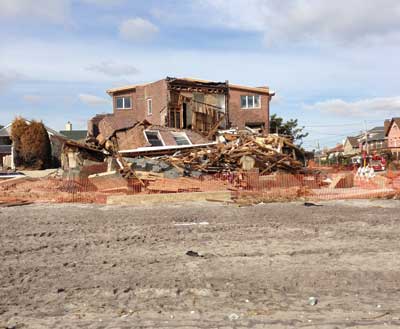 (2) This house in Rockaway, Queens, was totally destroyed.