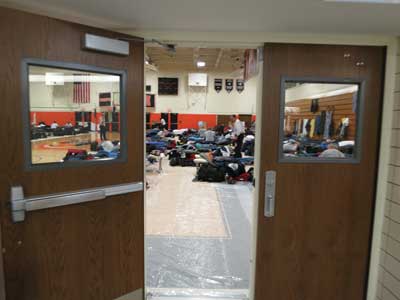 (13) A high school gym used for sleeping area for US&R task forces.