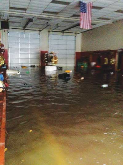 (4) An interior view of typical flooding inside the East Dover (NJ) Fire Company #4 station. [Photo courtesy of East Dover (NJ) Fire Company #4.]