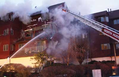 (10) The walls between floors began to separate, and the sides began to buckle as the floors began to collapse. The floor trusses came right through the side wall where the fire first appeared on arrival.