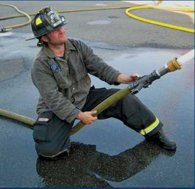 (1) A Clamp as the line is opened. While flowing, the nozzleman will remove his lead hand from the bail and place it behind the shank with the palm facing up. (Photos by author.)