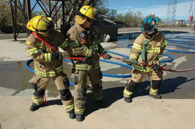 (3) Measuring the force needed to drag hose using a hanging weight scale. 