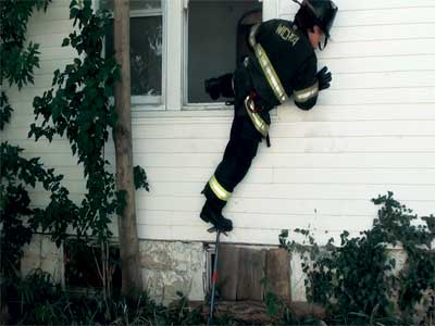 Drive the pike of the halligan into the siding when using it as a step to reduce the chances of its slipping. (Photos by author.)