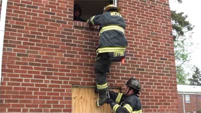 On masonry buildings, use a short webbing loop in conjunction with a six-foot roof hook to create the second step using a knee and the top of the hook.