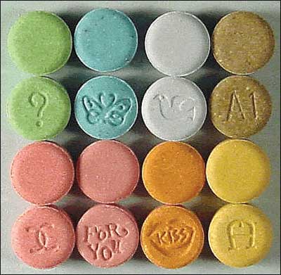 (1) Several types of MDMA tablets. (Photo courtesy of the Department of Justice.)