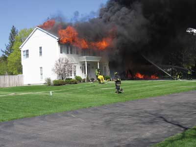 The garage fire quickly spread to the attic because of the wood products and construction techniques used in these new wood-frame buildings.