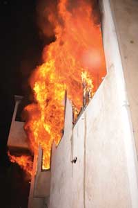 LAFD firefighters responded to an advanced fire in a three-story private dwelling built on a hillside.