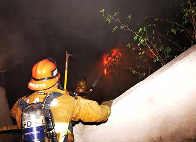 The second hoseline begins operating and advancing into the sublevel fire floor.