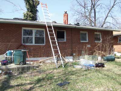 (4) Arriving at the rear of the building, the OV placed a ladder to provide a secondary means of egress from the roof and coordinated ventilation.