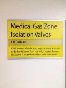 The pull-away cover for gas shut-off valves must be removed to access the valves.