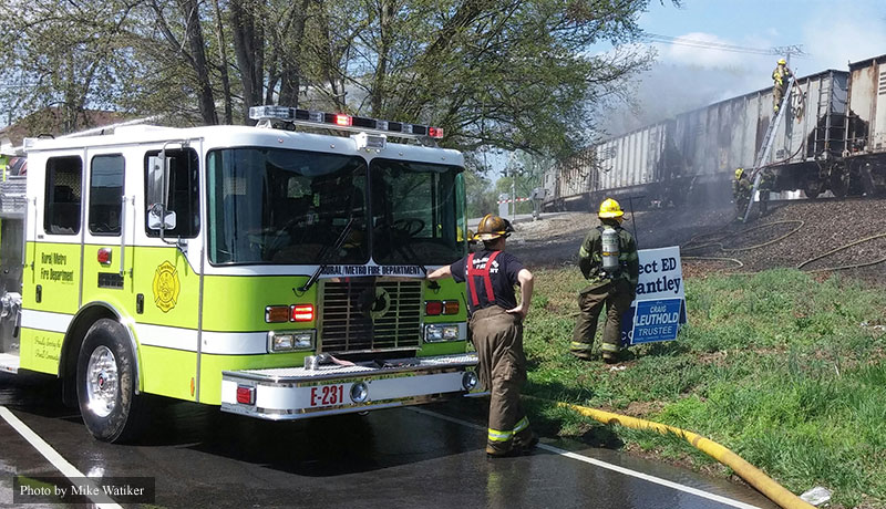 Firefighters and apparatus at the scene of a Tennessee train fire.