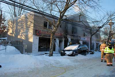 (11) The front of the fire building postcontrol. Note the stores on the first floor and the apartment above.