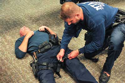 Law enforcement learning the techniques of Tactical Emergency Casualty Care.