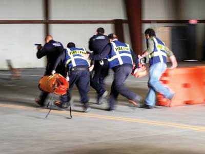 Law Enforcement and EMS learning the techniques of a coordinated response.