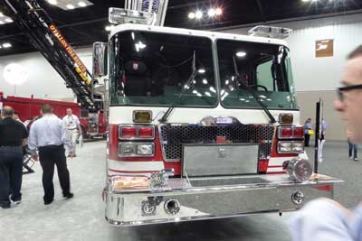 (9) Smeal's 105-foot aerial on its 100-inch-wide cab.