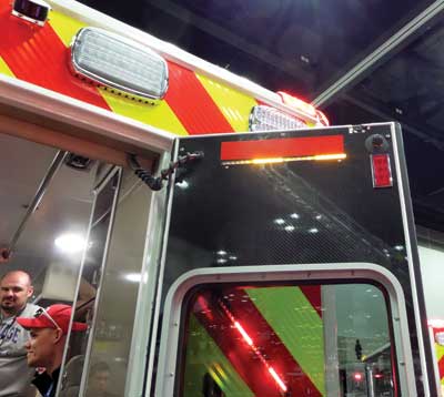 (39) LED strip warning lights on the interior of an ambulance door.