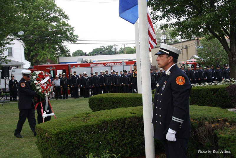 Commemorative wreaths are brought forward during the ceremony.