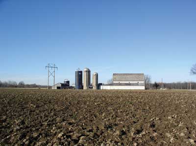 farm with four tower silos