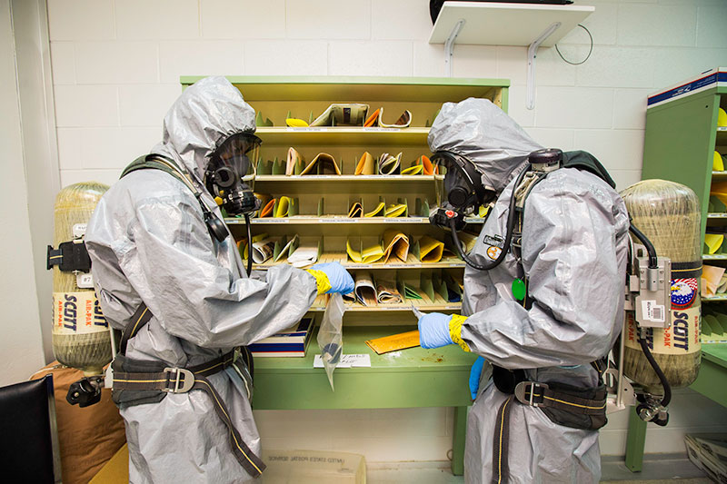 Emergency response personnel collect evidence in a mock postal center at the Center for Domestic Preparedness (CDP). The CDP training venues provide a realistic environment responders may find themselves in.